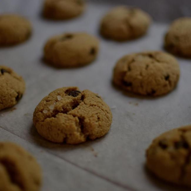 cookies on a baking sheet with a dark overlay